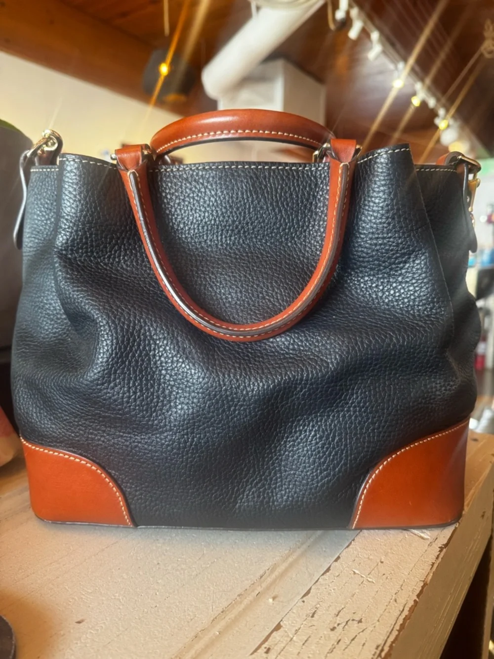 Dooney & Bourke Black Leather Tote with Brown Trim and Handles - Picture 4 of 10